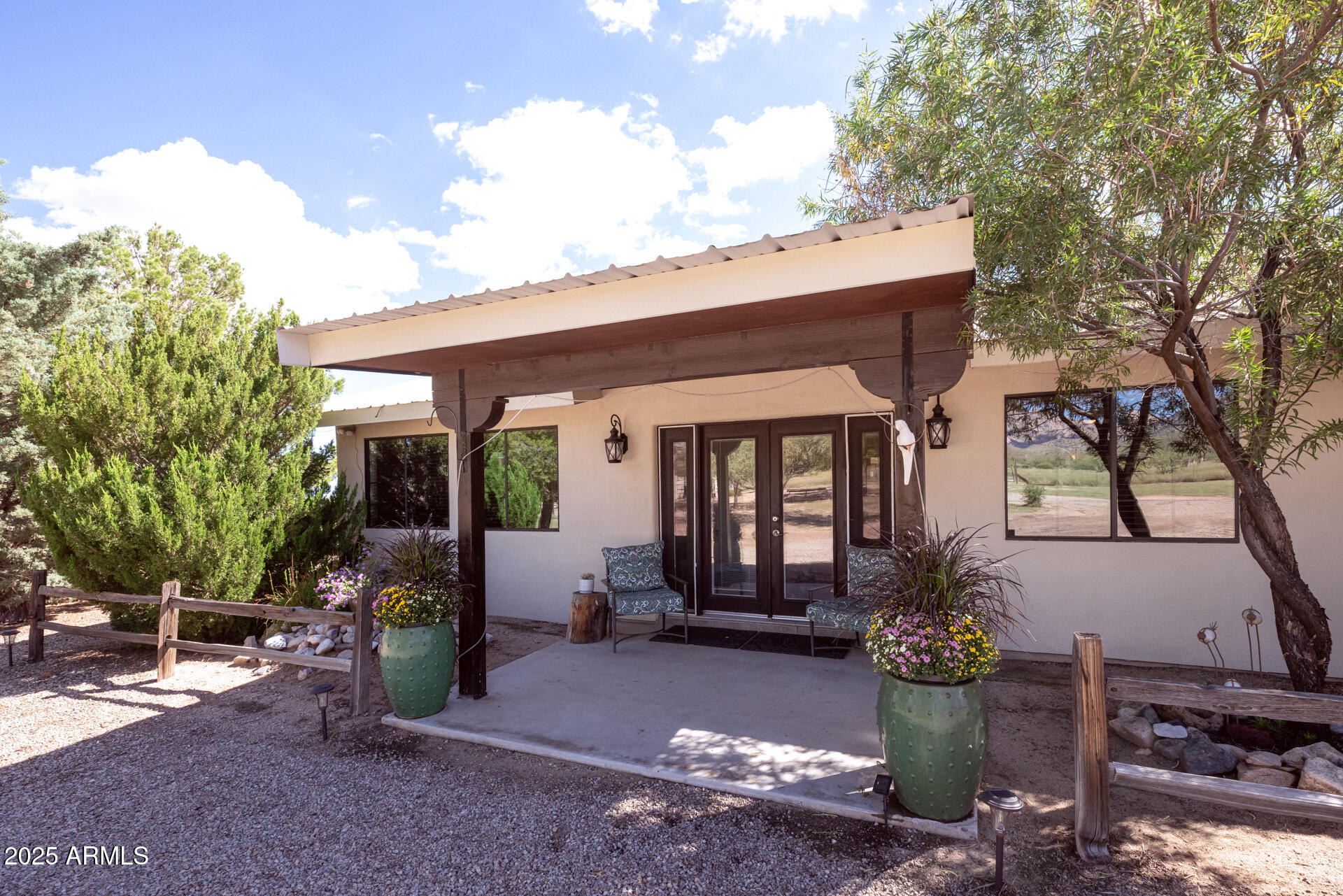 712 West Treasure Road Pearce, AZ 85625 - Photo 5 of 38 a front view of a house with garden