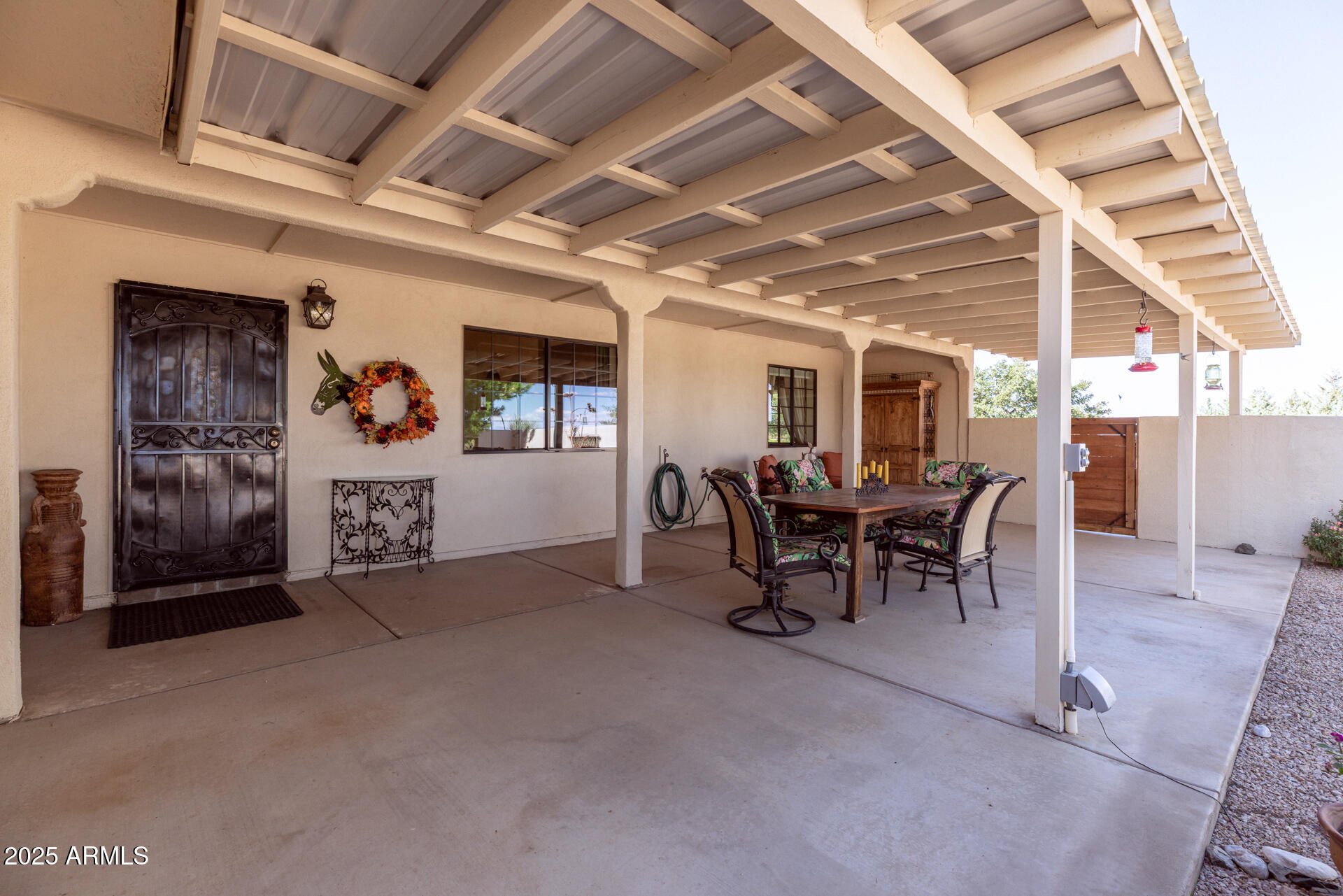 712 West Treasure Road Pearce, AZ 85625 - Photo 6 of 38 a view of a dining room with furniture and a chandelier