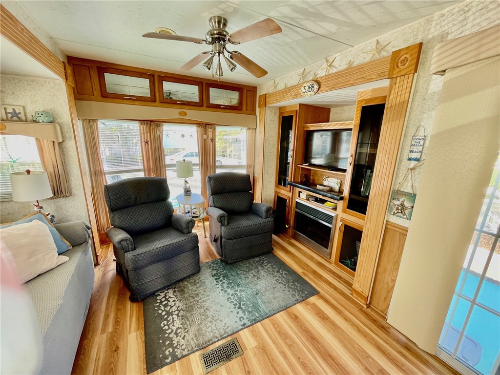 5288 Inlet Way Hutchinson Island, FL 34949 - Photo 17 of 21 a living room with furniture and a fireplace