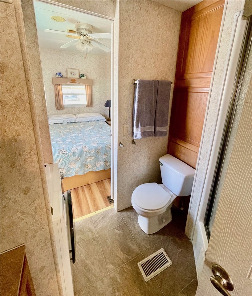 5288 Inlet Way Hutchinson Island, FL 34949 - Photo 19 of 21 a bathroom with a toilet and a shower