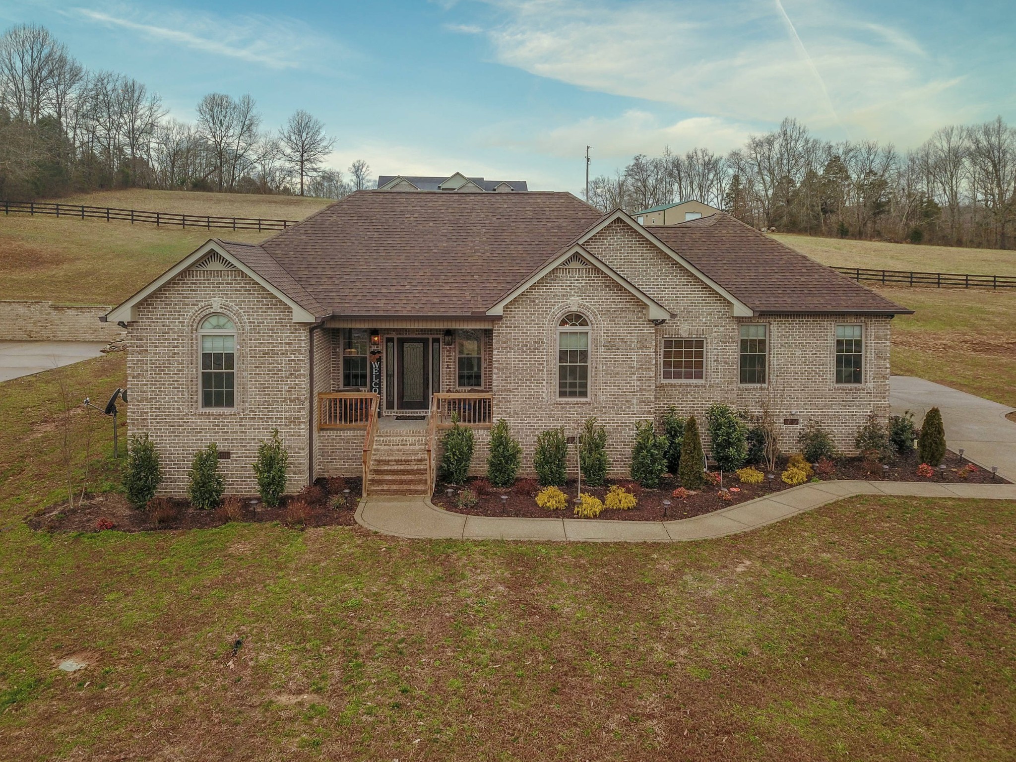 1648 Old Gallatin Road Portland, TN 37148 - Photo 1 of 25 a front view of a house with a yard