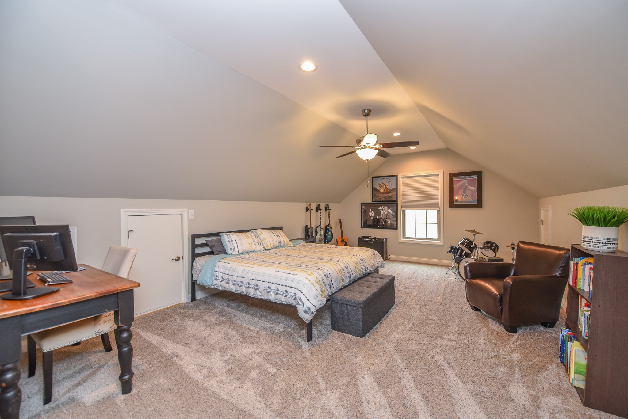 1648 Old Gallatin Road Portland, TN 37148 - Photo 24 of 25 a spacious bedroom with a bed a desk and chair
