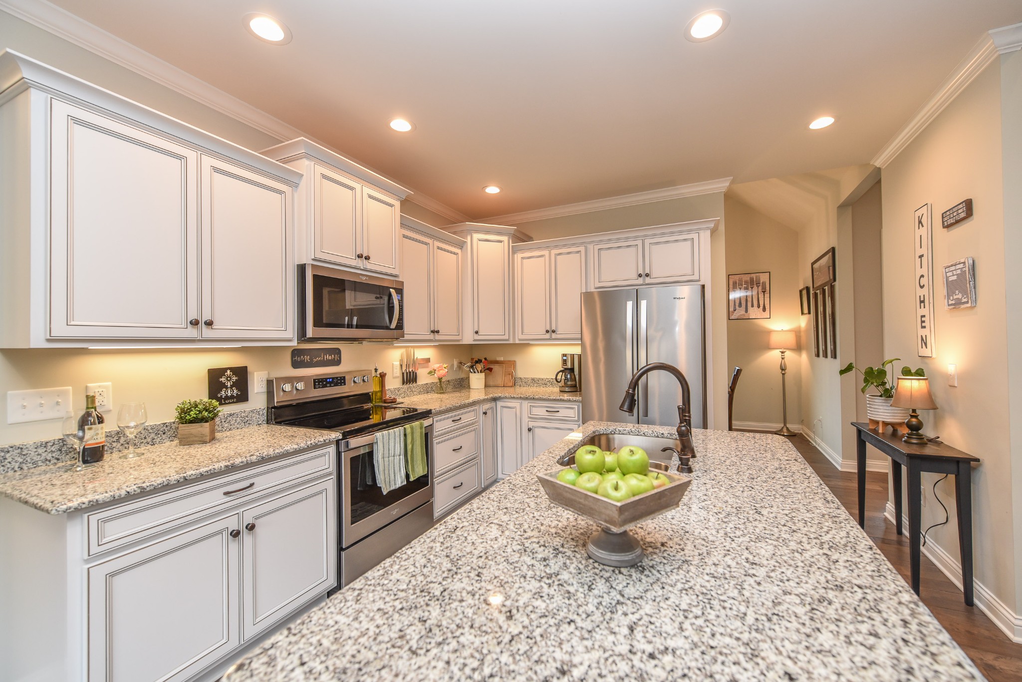1648 Old Gallatin Road Portland, TN 37148 - Photo 6 of 25 a kitchen with a sink a stove a refrigerator cabinets and a dining table