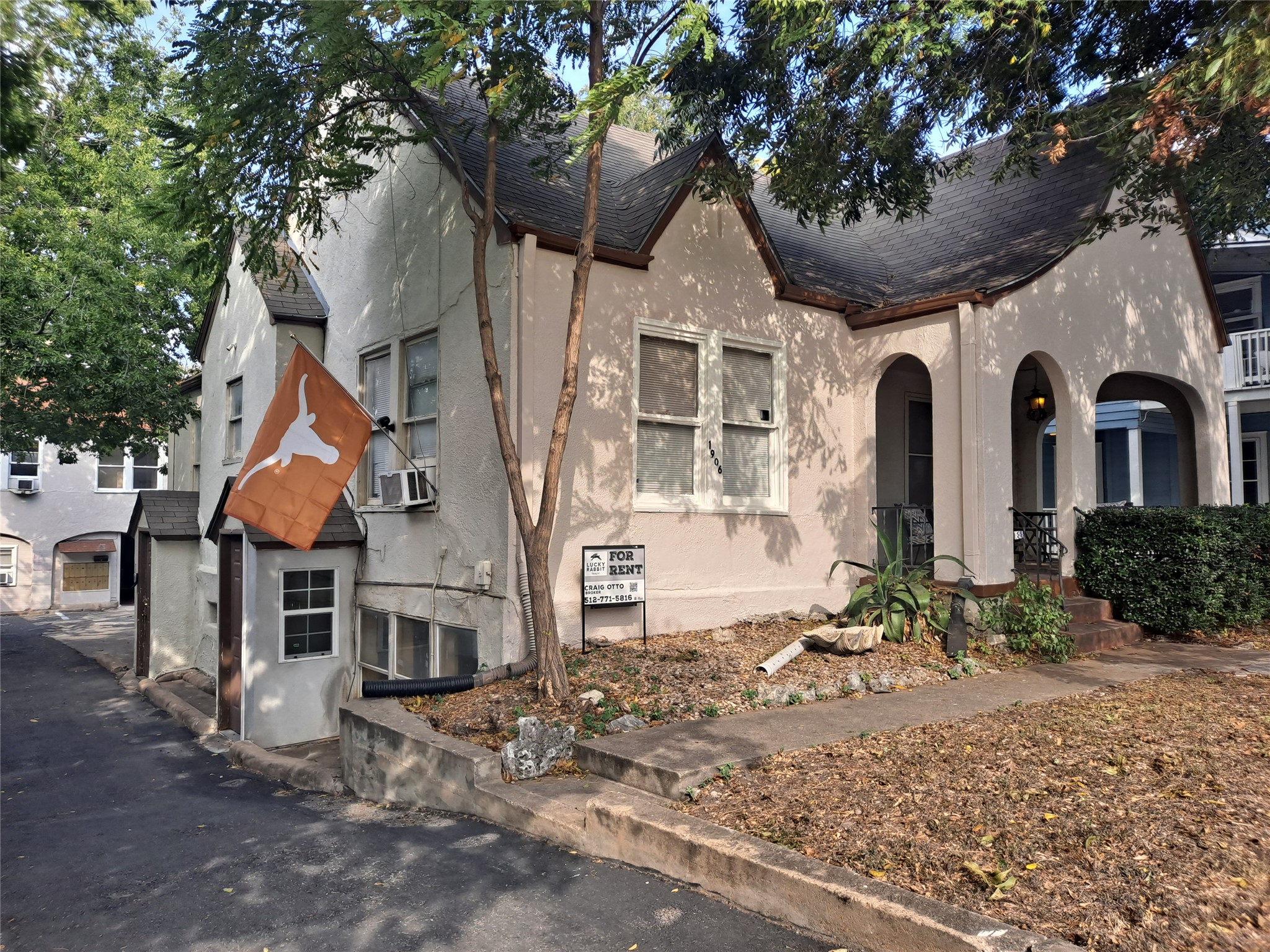 1906 San Gabriel Street, Unit 17 Austin, TX 78705 - Photo 2 of 7 a front view of a house with garden