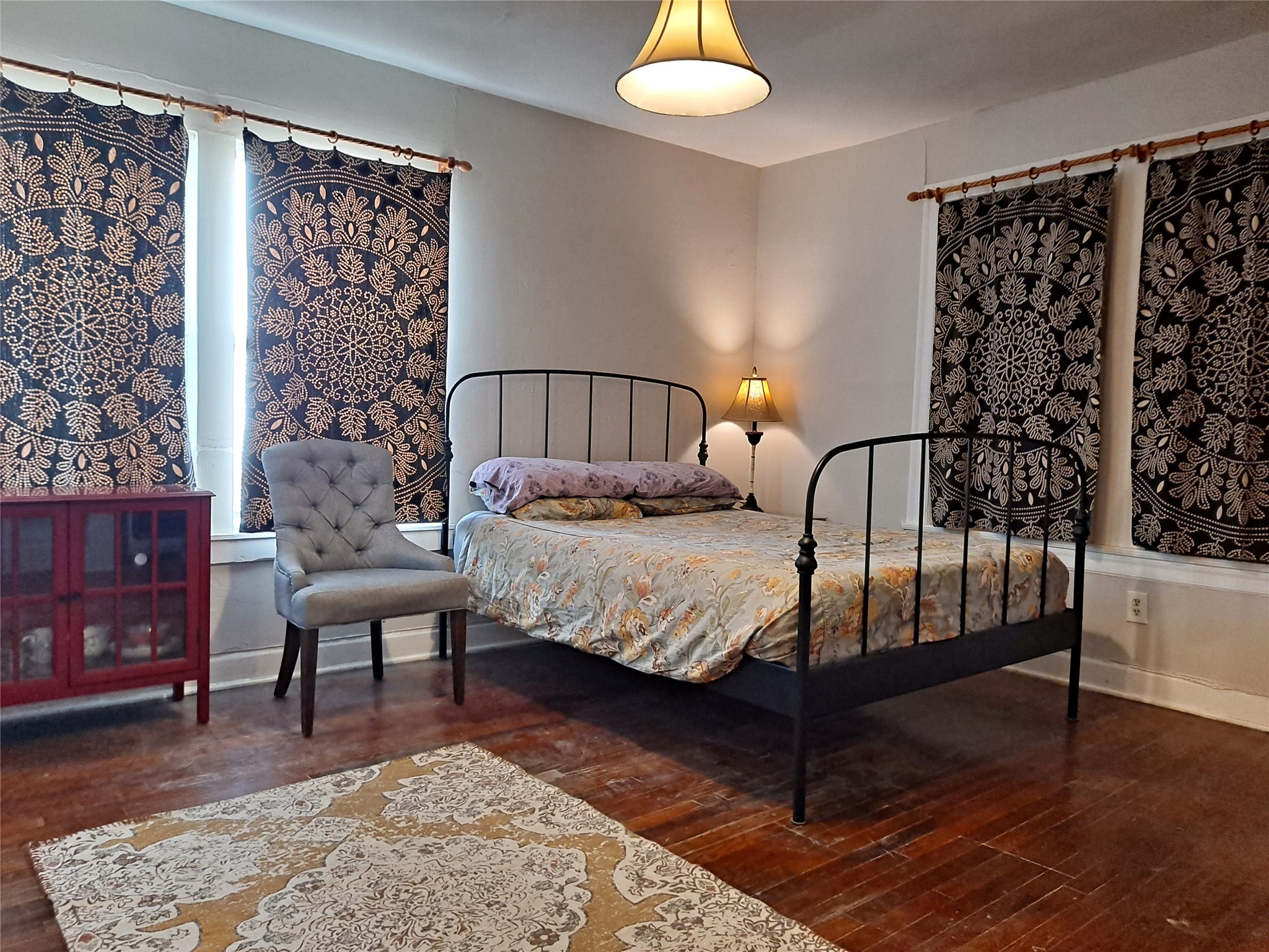 1906 San Gabriel Street, Unit 17 Austin, TX 78705 - Photo 3 of 7 a bedroom with a bed window and a table