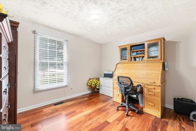 a workspace with furniture and a window