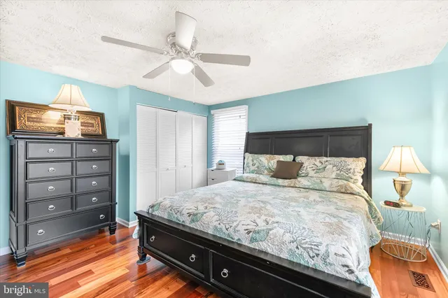a bedroom with a bed and a cabinets