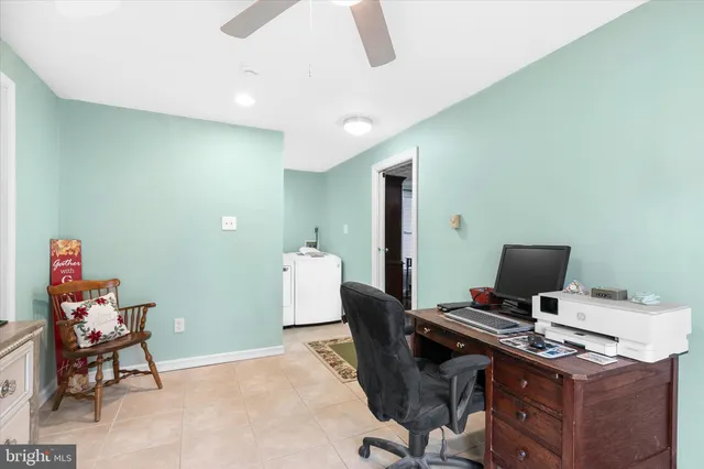 a view of a workspace with furniture