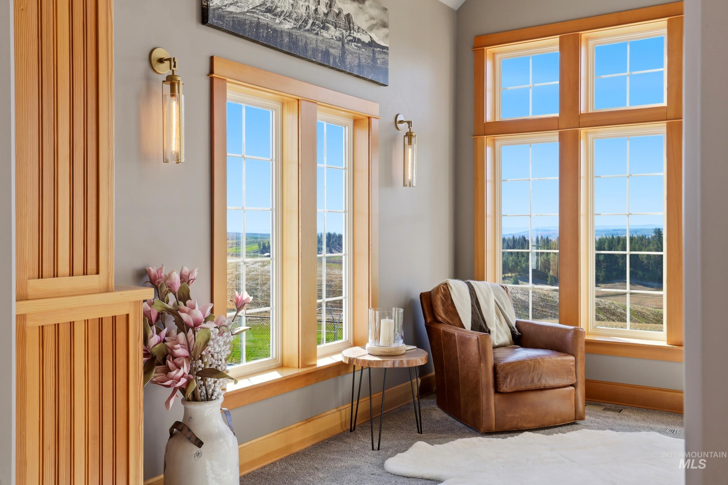 1014 Hilby Road Moscow, ID 83843 - Photo 14 of 50 Living area with plenty of natural light and carpet flooring