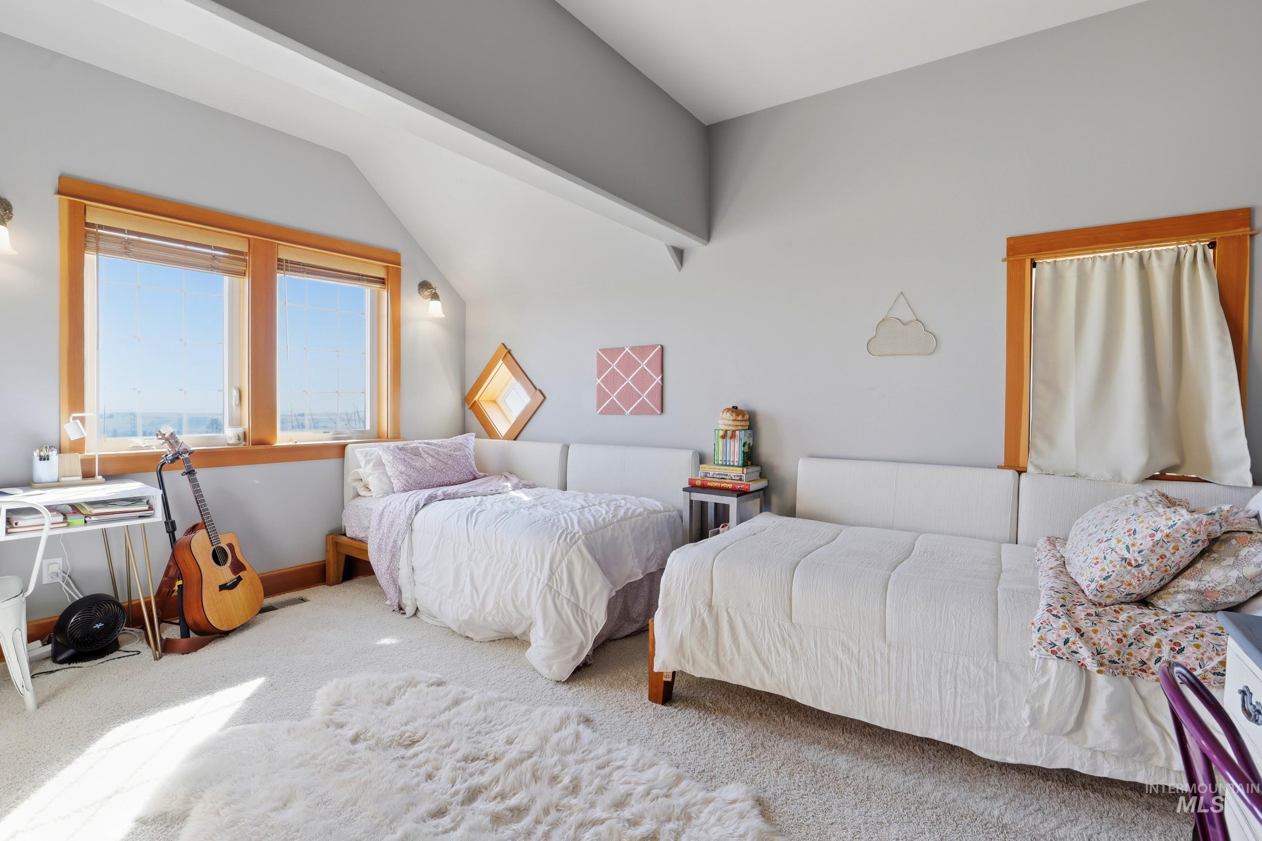 1014 Hilby Road Moscow, ID 83843 - Photo 26 of 50 Carpeted bedroom featuring vaulted ceiling and baseboards