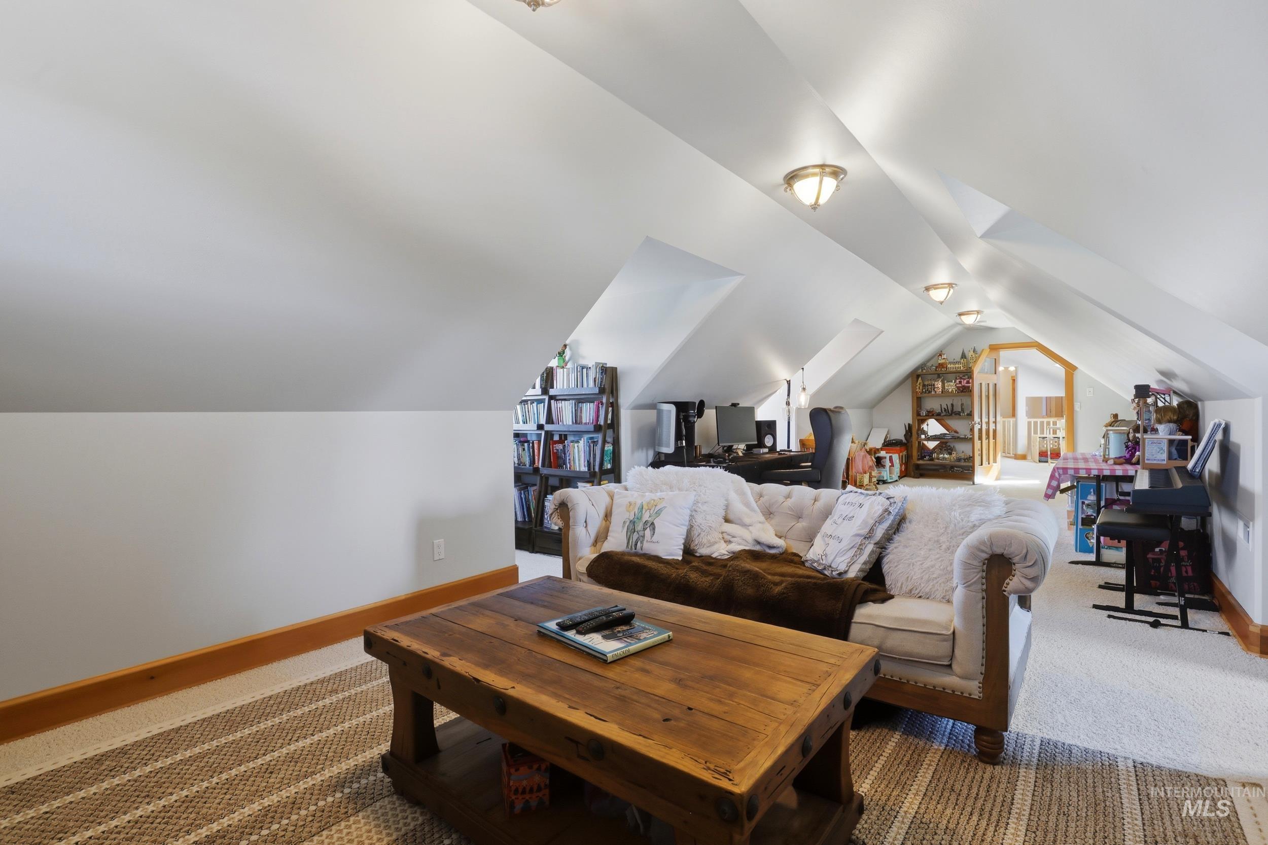 1014 Hilby Road Moscow, ID 83843 - Photo 28 of 50 Carpeted living area featuring baseboards