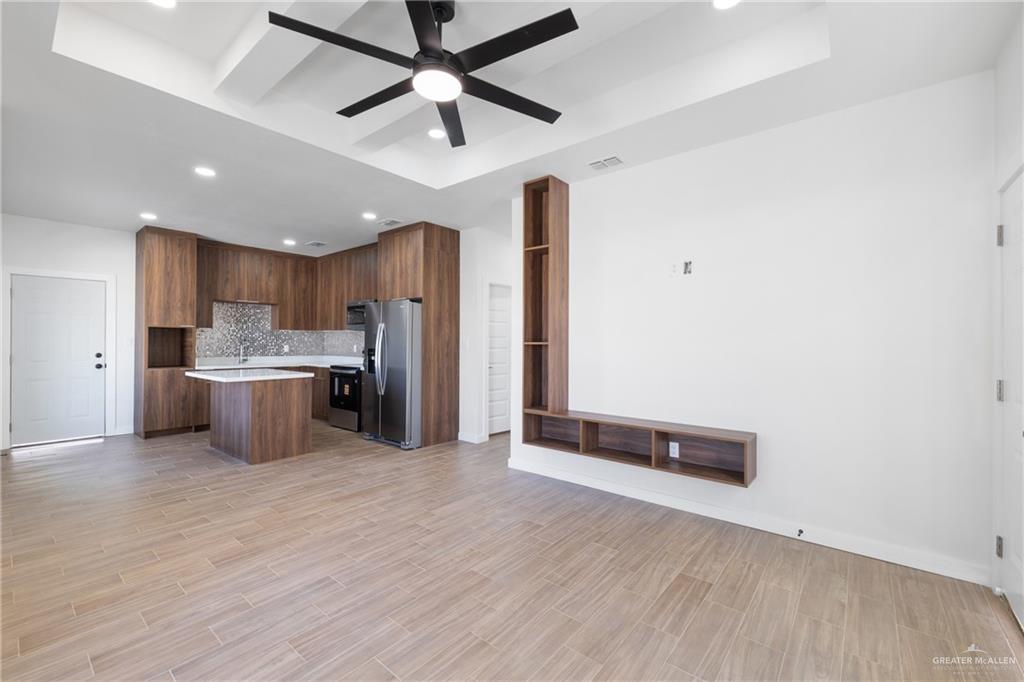 2900 Gabriel Street, Unit 1 Mission, TX 78574 - Photo 14 of 14 a view of kitchen with stainless steel appliances refrigerator stove and wooden cabinets