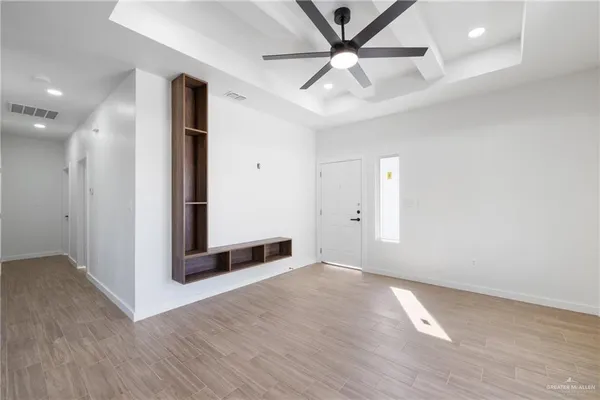 a kitchen with a sink appliances and cabinets