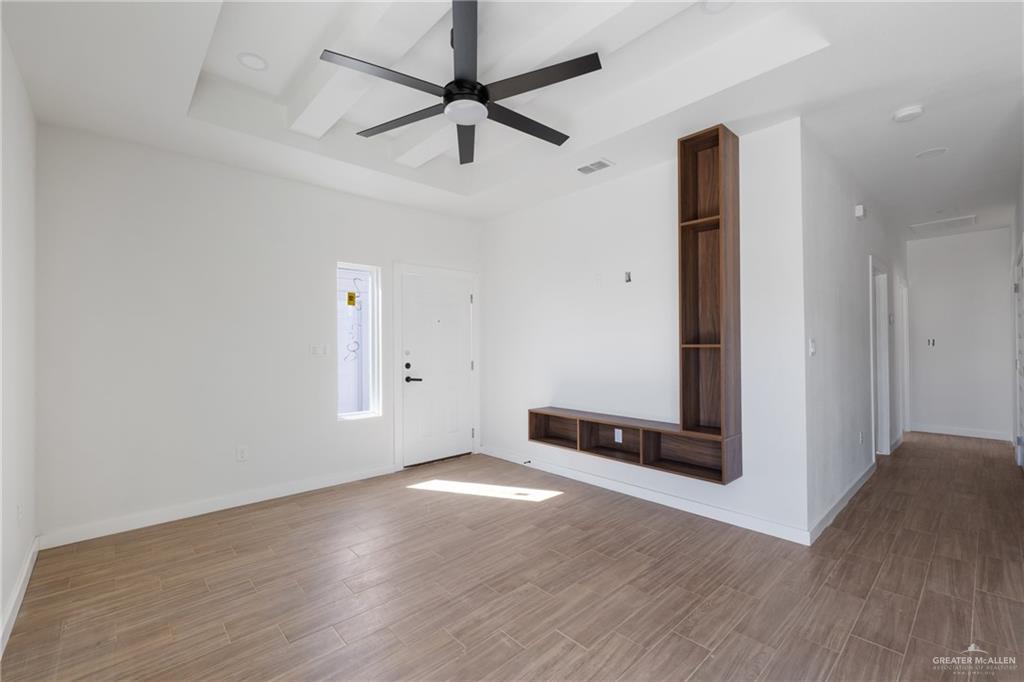 2900 Gabriel Street, Unit 1 Mission, TX 78574 - Photo 5 of 14 an empty room with wooden floor and windows