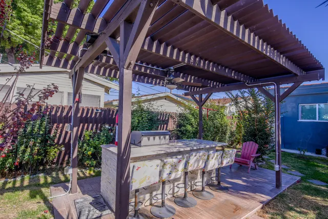 a view of a chairs and table in the patio
