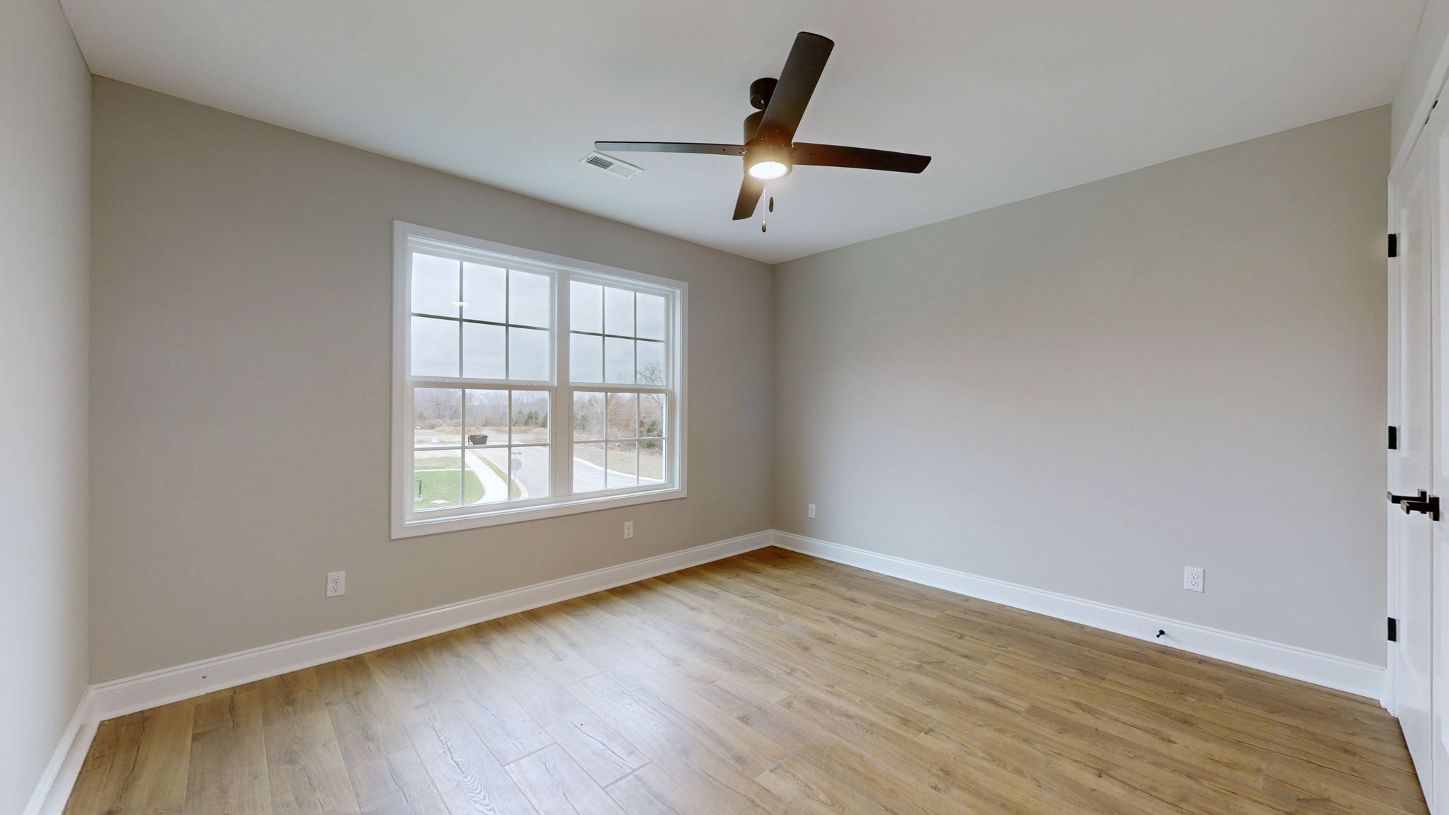 1417 Rooster Rdg Road Joelton, TN 37080 - Photo 15 of 24 an empty room with wooden floor fan and windows