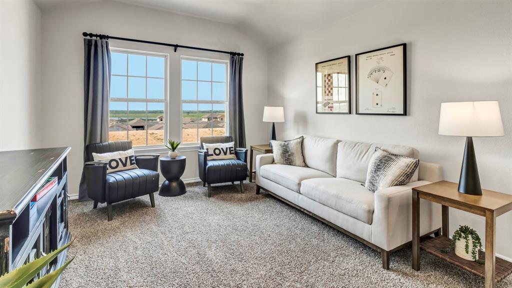 124 Pheasant Run Road Terrell, TX 75160 - Photo 34 of 35 Spacious room featuring vaulted ceilings, two large windows with grid patterns, light-toned carpeting, and neutral wall finishes