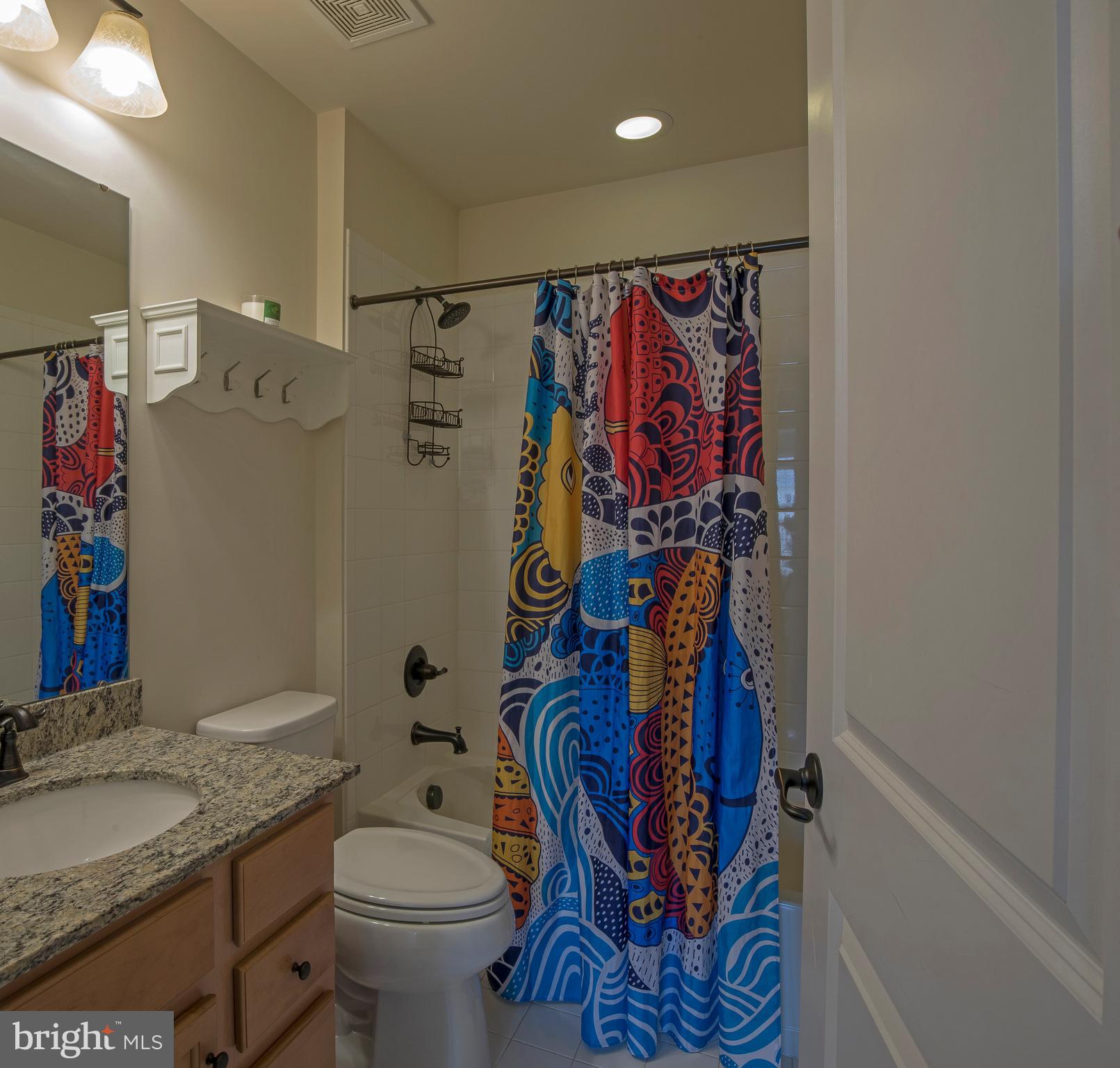 3713 Christopher Day Road Doylestown, PA 18902 - Photo 12 of 20 a bathroom with a toilet sink and mirror