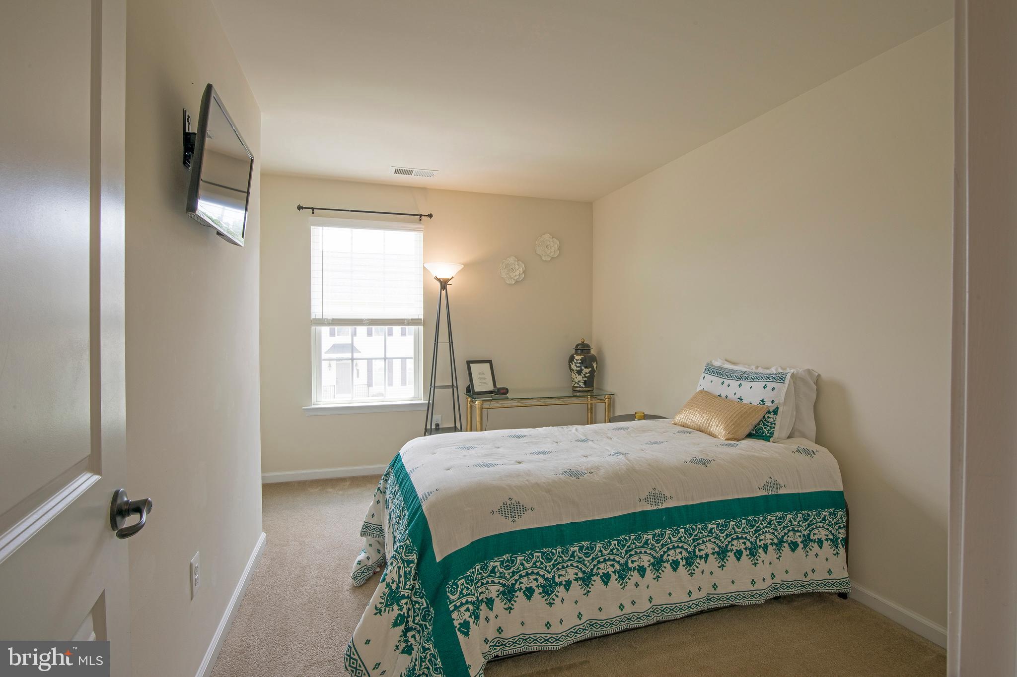 3713 Christopher Day Road Doylestown, PA 18902 - Photo 14 of 20 a bedroom with a bed chair and window