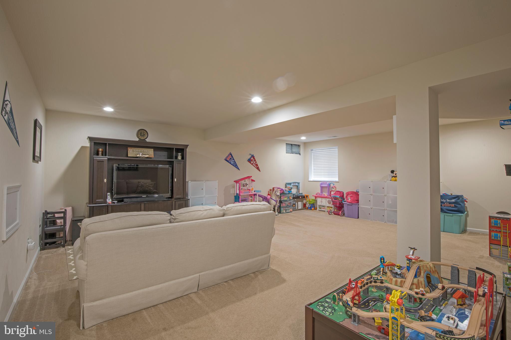 3713 Christopher Day Road Doylestown, PA 18902 - Photo 15 of 20 a living room with furniture and a flat screen tv