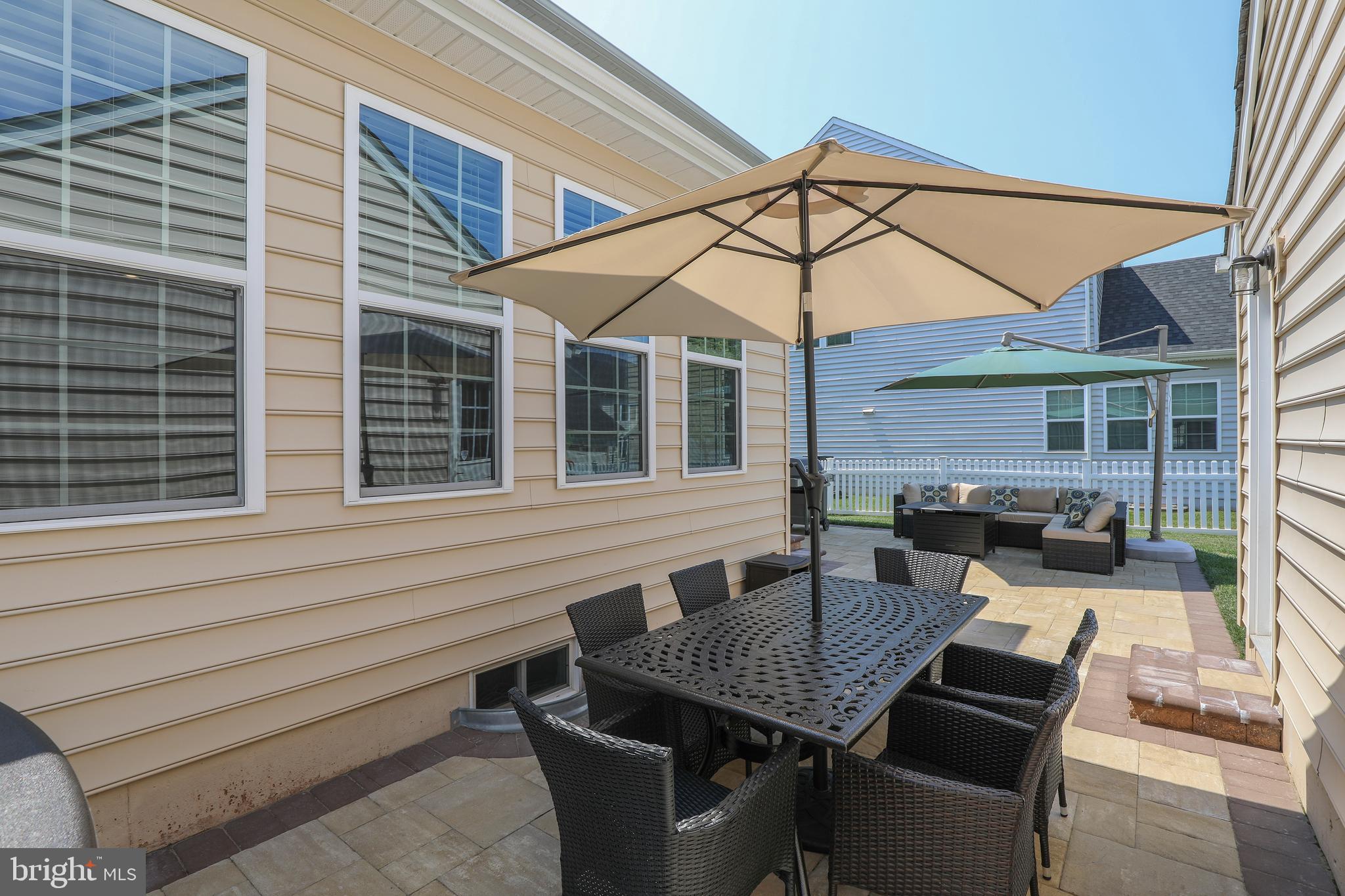 3713 Christopher Day Road Doylestown, PA 18902 - Photo 18 of 20 a backyard of a house with barbeque oven table and chairs