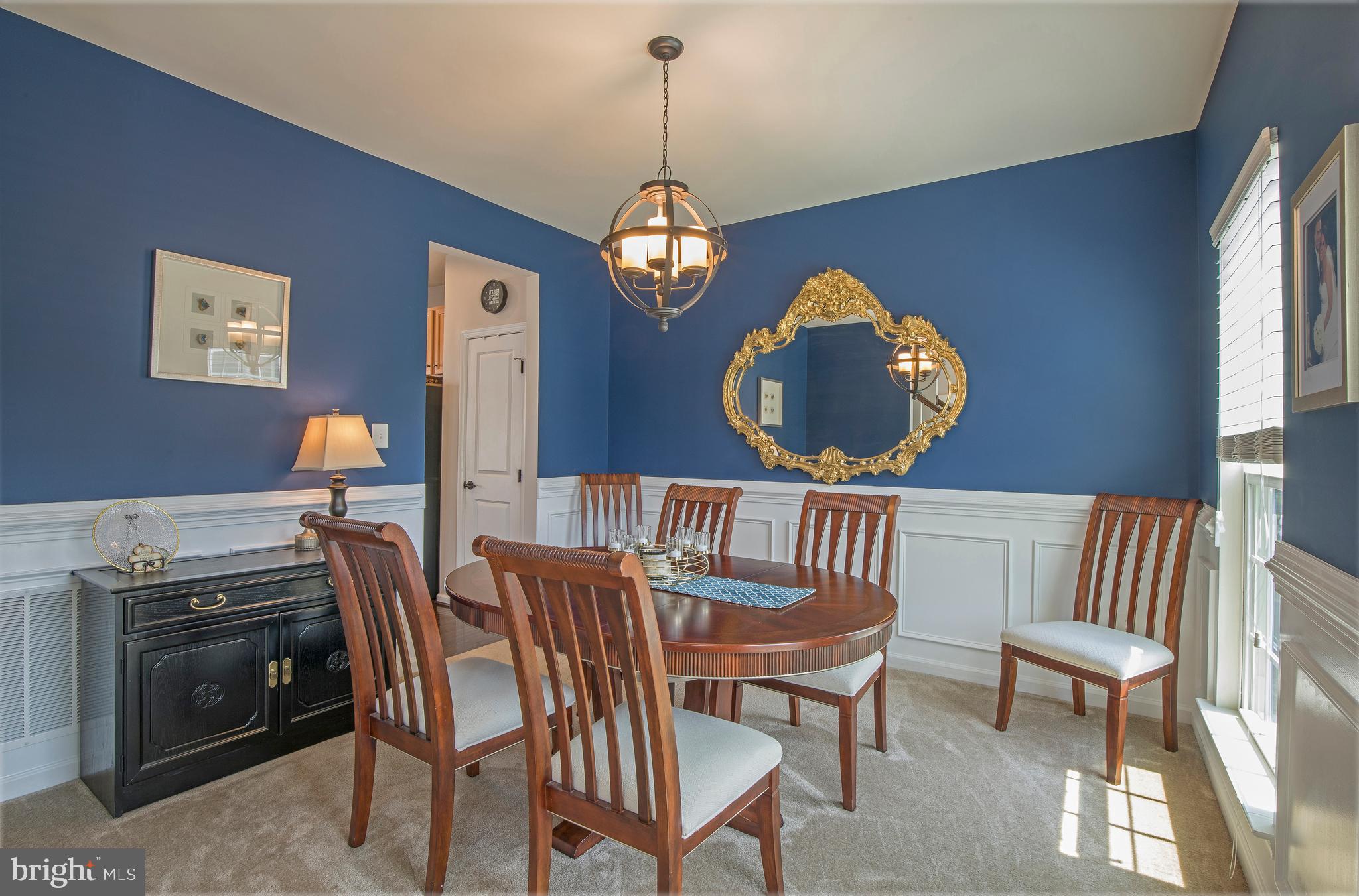3713 Christopher Day Road Doylestown, PA 18902 - Photo 3 of 20 a view of a dining room with furniture wooden floor and a chandelier