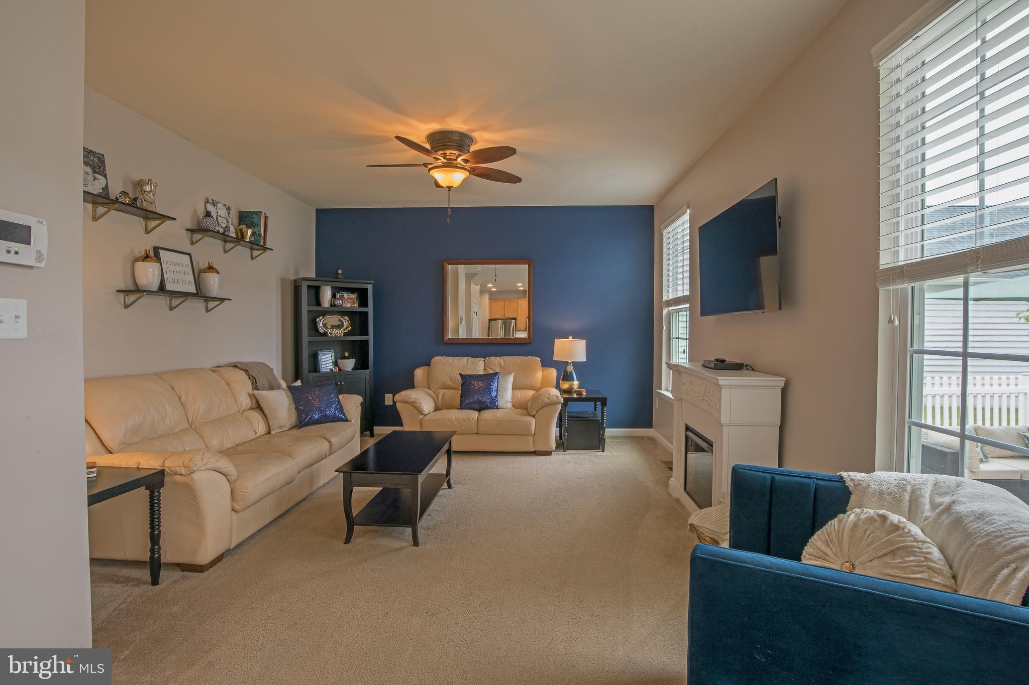 3713 Christopher Day Road Doylestown, PA 18902 - Photo 4 of 20 a living room with furniture and a flat screen tv