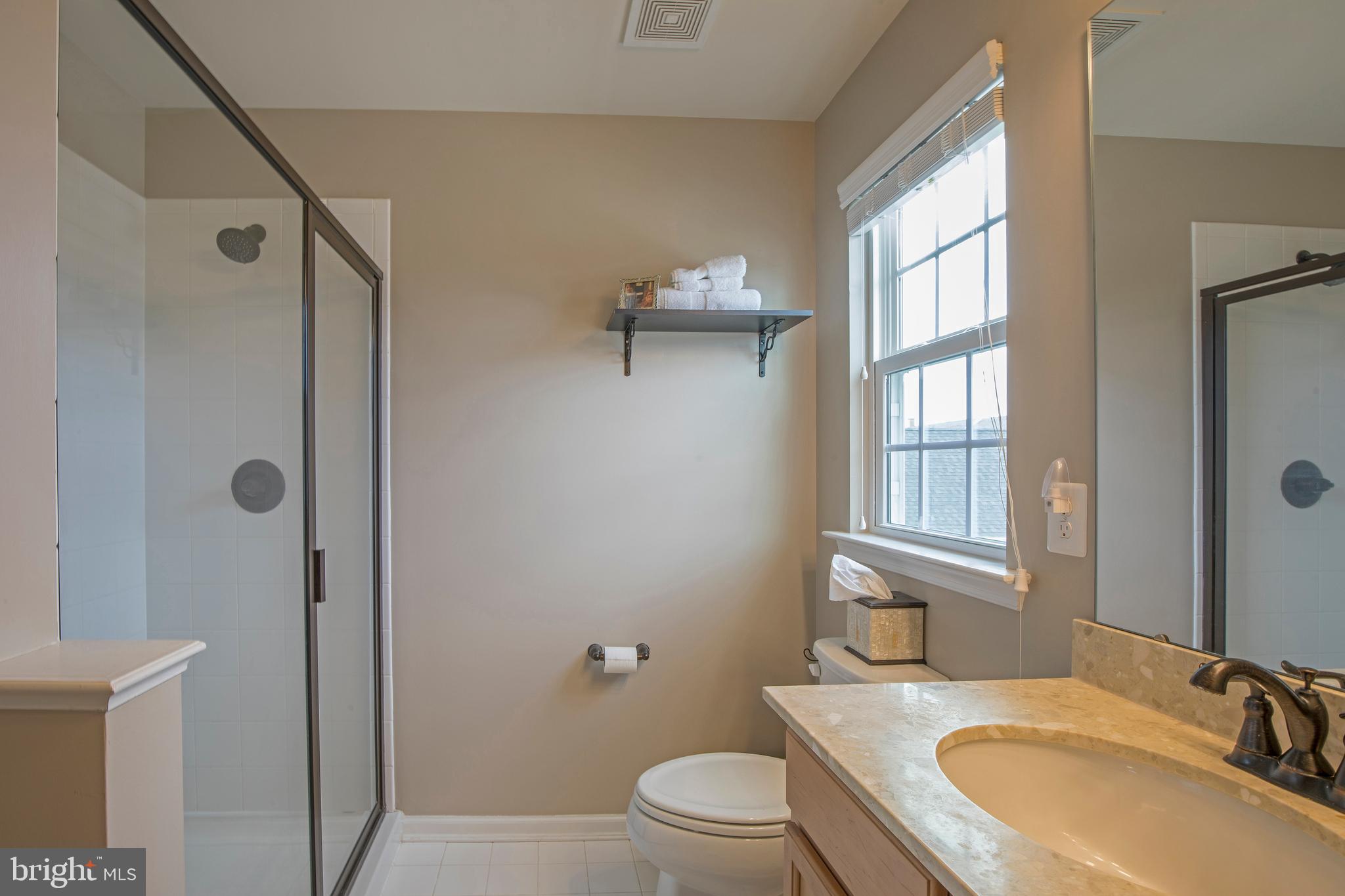 3713 Christopher Day Road Doylestown, PA 18902 - Photo 9 of 20 a bathroom with a granite countertop sink toilet and shower