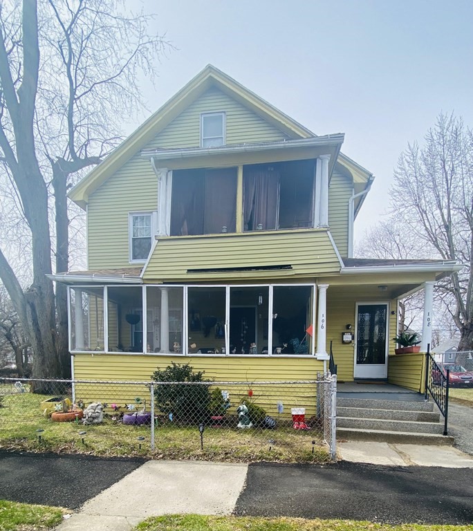 106-108 Maynard Street Springfield, MA 01109 - Photo 1 of 14 a front view of a house with a yard