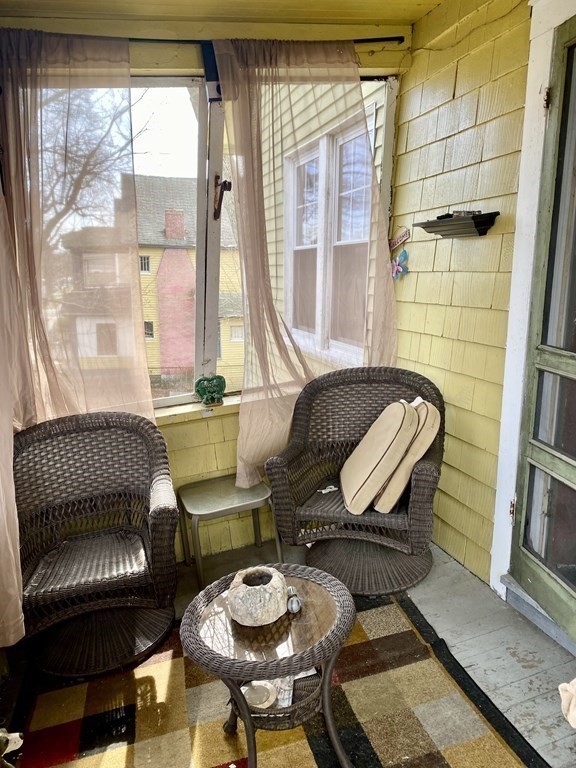 106-108 Maynard Street Springfield, MA 01109 - Photo 11 of 14 a living room with furniture and a window