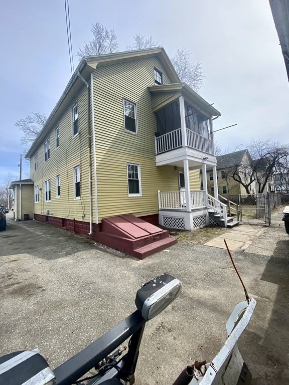 106-108 Maynard Street Springfield, MA 01109 - Photo 14 of 14 a front view of a house with parking space