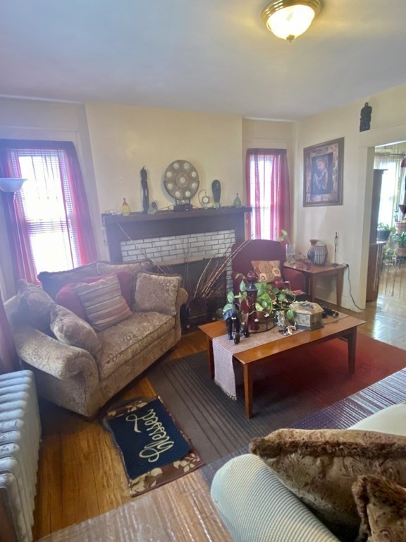 106-108 Maynard Street Springfield, MA 01109 - Photo 3 of 14 a living room with furniture and a couch