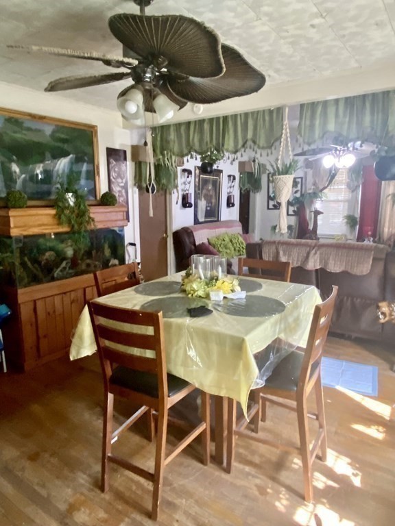 106-108 Maynard Street Springfield, MA 01109 - Photo 4 of 14 a table and chairs in front of a building