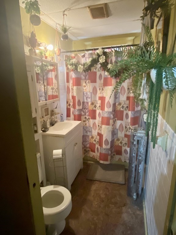 106-108 Maynard Street Springfield, MA 01109 - Photo 6 of 14 a bathroom with a sink toilet and shower