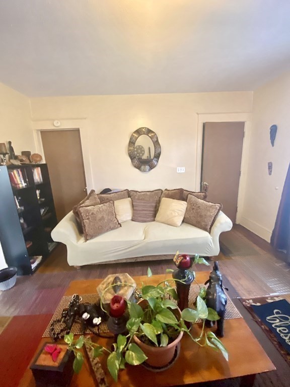 106-108 Maynard Street Springfield, MA 01109 - Photo 8 of 14 a living room with furniture and flowers