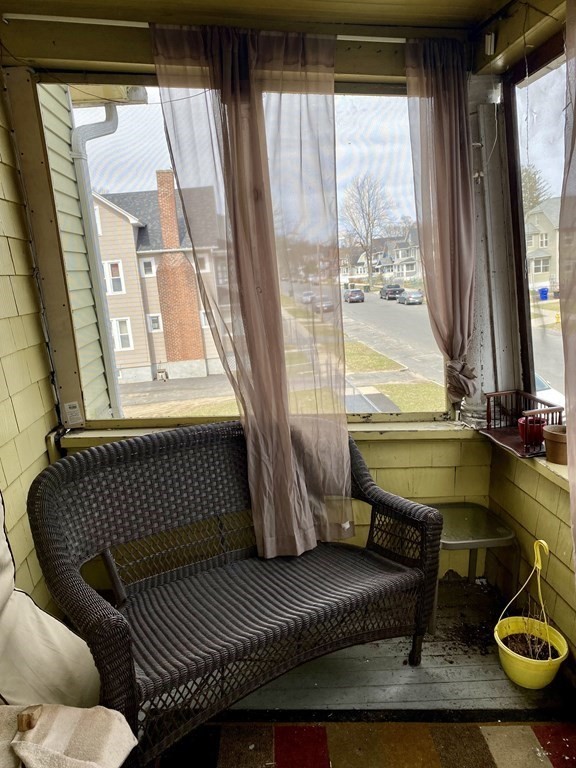 106-108 Maynard Street Springfield, MA 01109 - Photo 10 of 14 a living room with furniture and a window