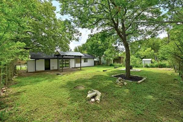 a house with huge green field in front of it