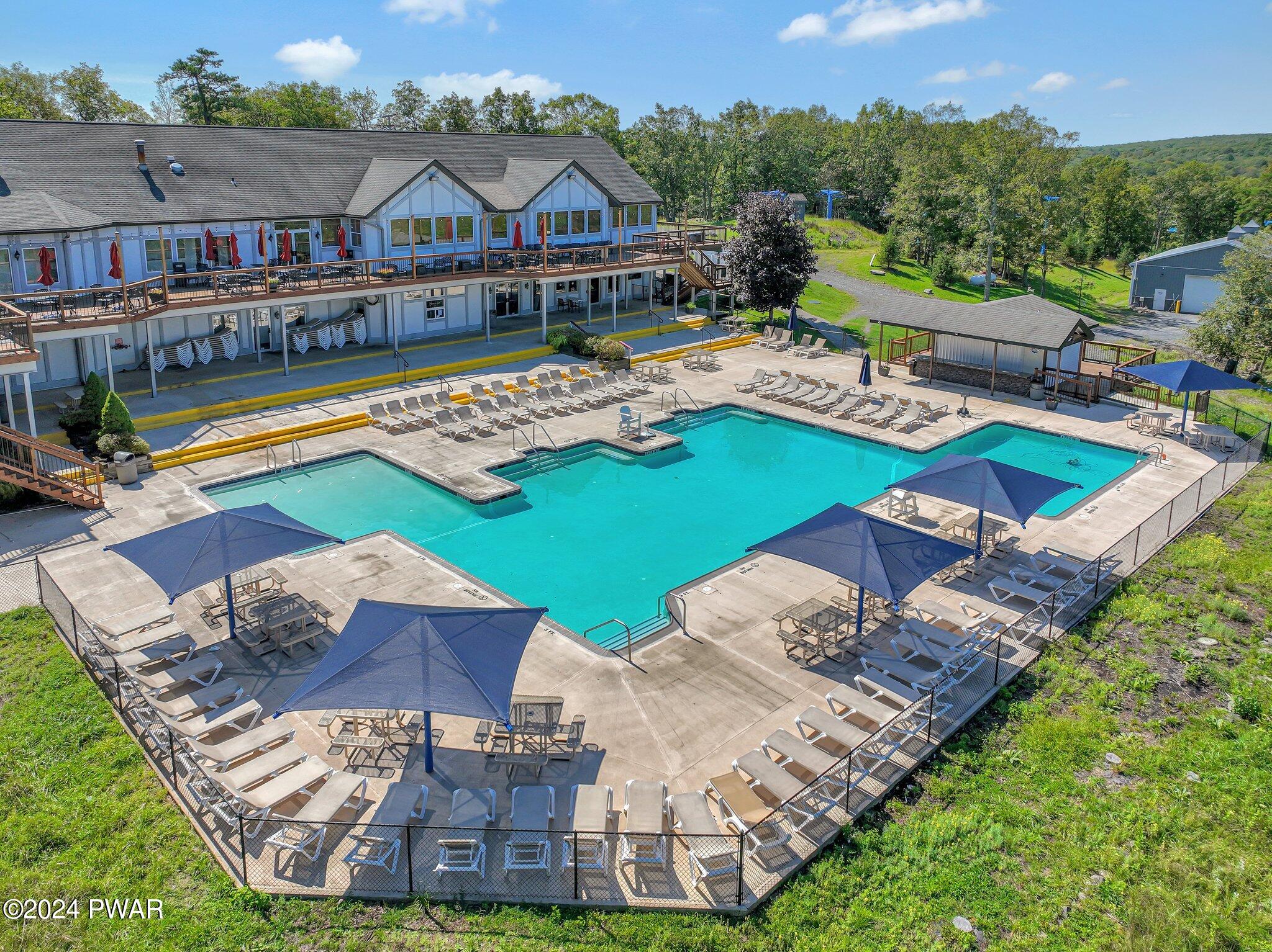3178 Cherry Ridge Road Bushkill, PA 18324 - Photo 47 of 54 an aerial view of a house with swimming pool patio and outdoor seating