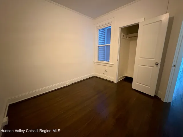 a view of wooden floor in an empty room