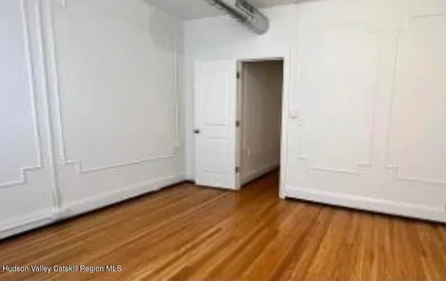 a front view of a house with parking space