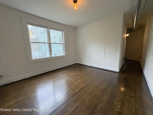 a kitchen with a stove a refrigerator and a sink