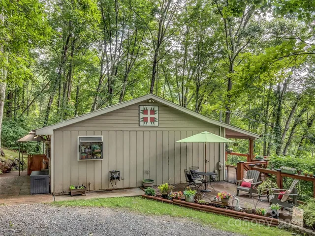 a view of a city with lush green forest
