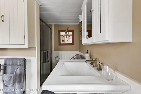 a kitchen with sink window and cabinets