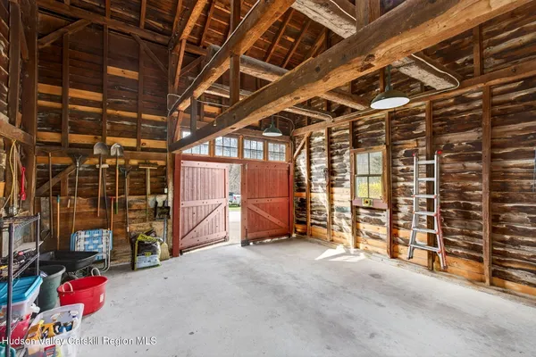a view of empty room with wooden ceiling