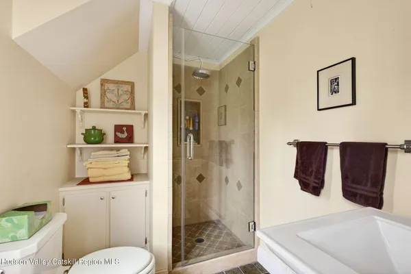 a bathroom with a toilet sink and shower