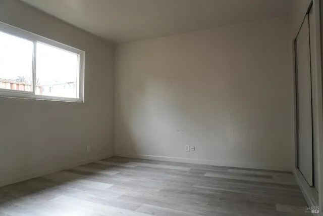 a view of a backyard with sitting area and wooden fence