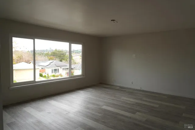 a kitchen with a sink cabinets and window