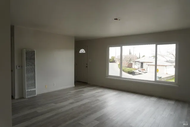 a kitchen with cabinets and window