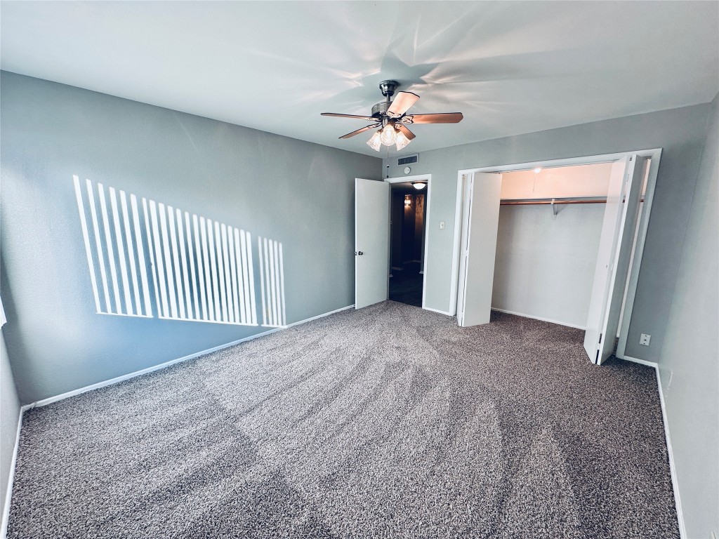 601 West 11th Street, Unit 227 Austin, TX 78701 - Photo 16 of 18 a view of an empty room with a chandelier fan