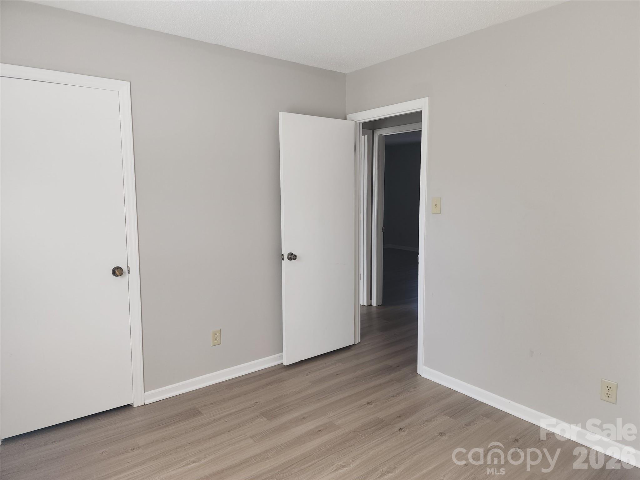 150 Autumn Leaf Road Troutman, NC 28166 - Photo 11 of 21 a view of an empty room with wooden floor and closet